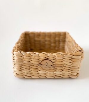 Evara’s artisanal storage basket handcrafted from 100% natural banana fiber, designed with a sturdy woven structure, minimalist aesthetic, and smooth natural finish. Ideal for organizing living spaces, storing linens, toys, or accessories. Lightweight yet durable, with reinforced edges and optional handles for easy mobility. A biodegradable, eco-friendly home décor piece that blends functionality with timeless elegance.