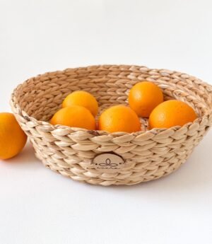 Evara’s artisanal storage basket handcrafted from 100% natural banana fiber, designed with a sturdy woven structure, minimalist aesthetic, and smooth natural finish. Ideal for organizing living spaces, storing linens, toys, or accessories. Lightweight yet durable, with reinforced edges and optional handles for easy mobility. A biodegradable, eco-friendly home décor piece that blends functionality with timeless elegance.