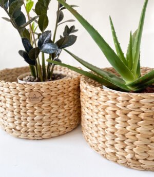 Evara’s artisanal storage basket handcrafted from 100% natural banana fiber, designed with a sturdy woven structure, minimalist aesthetic, and smooth natural finish. Ideal for organizing living spaces, storing linens, toys, or accessories. Lightweight yet durable, with reinforced edges and optional handles for easy mobility. A biodegradable, eco-friendly home décor piece that blends functionality with timeless elegance.